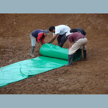  Spreading the liner in the new pond.